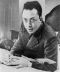 Albert_Camus,_gagnant_de_prix_Nobel,_portrait_en_buste,_posé_au_bureau,_faisant_face_à_gauche,_cigarette_de_tabagisme.jpg